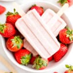 Vegan Strawberry Coconut Popsicles (V, GF, DF): a 4 ingredient, plant-based recipe for creamy, refreshing popsicles bursting with strawberry and coconut flavor. #Vegan #DairyFree #Paleo #GlutenFree | BeamingBaker.com