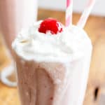 Vegan Strawberry Coconut Milkshake (V+GF): a 4 ingredient recipe for creamy and thick strawberry coconut milkshakes. #Vegan #GlutenFree #DairyFree #Paleo | BeamingBaker.com
