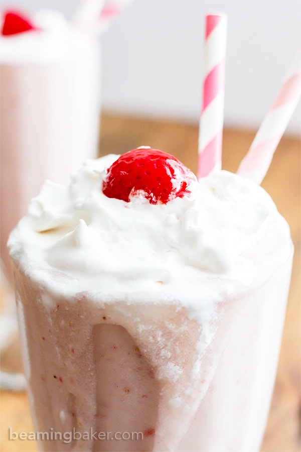 Vegan Strawberry Coconut Milkshake (V+GF): a 4 ingredient recipe for creamy and thick strawberry coconut milkshakes. #Vegan #GlutenFree #DairyFree #Paleo | BeamingBaker.com