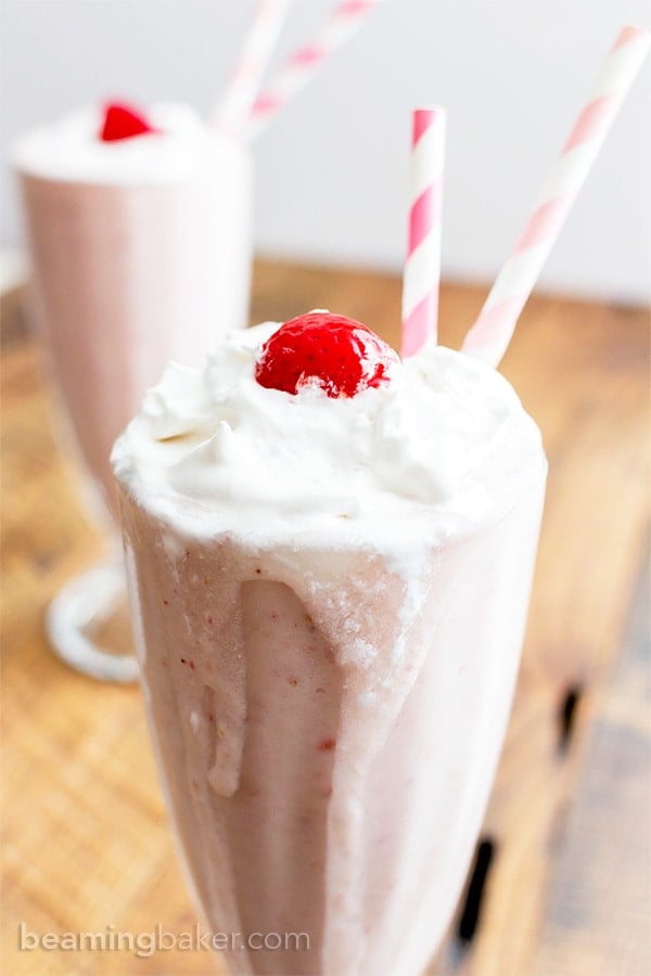 Vegan Strawberry Coconut Milkshake (V+GF): a 4 ingredient recipe for creamy and thick strawberry coconut milkshakes. #Vegan #GlutenFree #DairyFree #Paleo | BeamingBaker.com