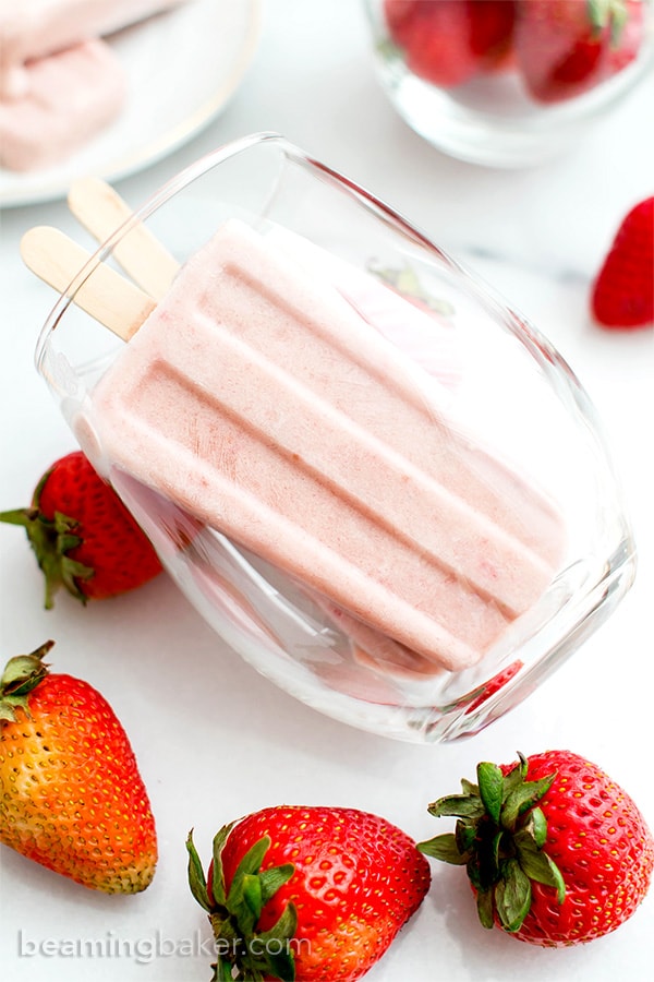 Vegan Strawberry Coconut Popsicles (V, GF, DF): a 4 ingredient, plant-based recipe for creamy, refreshing popsicles bursting with strawberry and coconut flavor. #Vegan #DairyFree #Paleo #GlutenFree | BeamingBaker.com