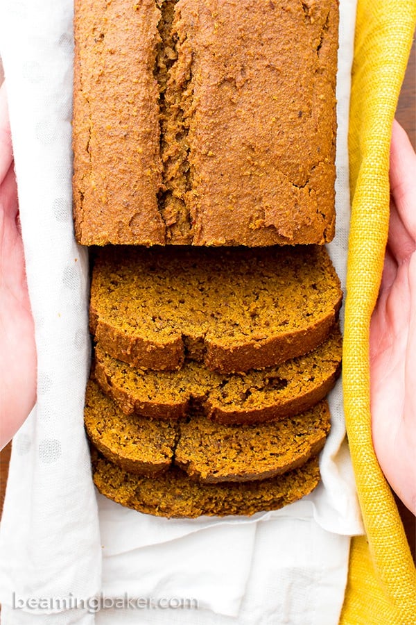 overhead vegan gluten free pumpkin bread in hands