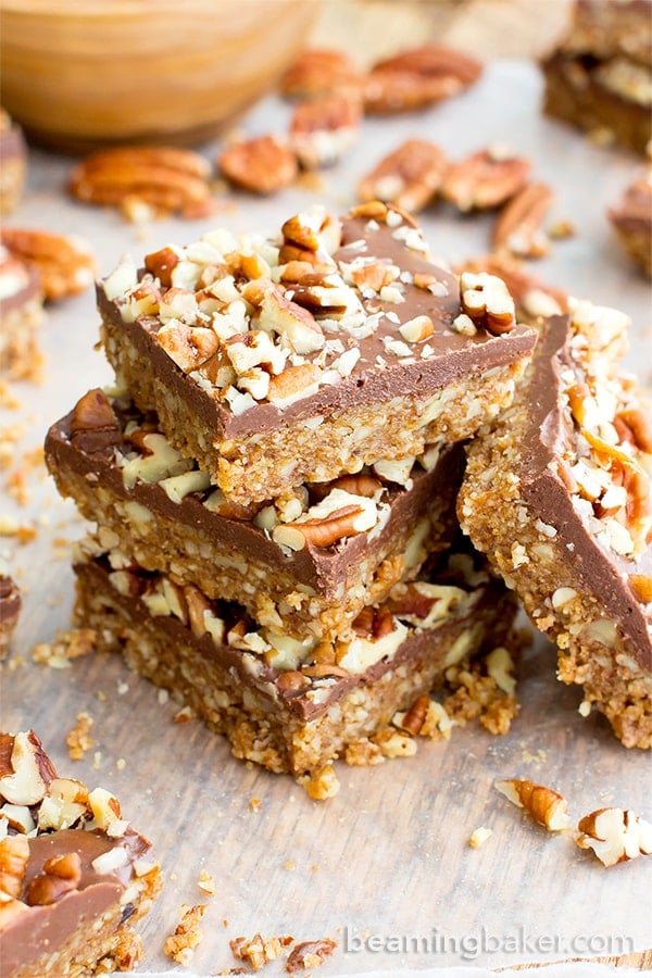 No Bake Paleo Chocolate Pecan Bars (V, GF, Paleo): a 5-ingredient, no bake recipe for deliciously textured pecan bars topped with a thick layer of chocolate and nuts. #Paleo #Vegan #GlutenFree #DairyFree | BeamingBaker.com