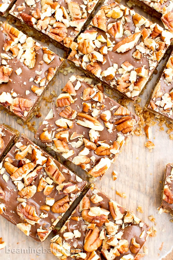 No Bake Paleo Chocolate Pecan Bars (V, GF, Paleo): a 5-ingredient, no bake recipe for deliciously textured pecan bars topped with a thick layer of chocolate and nuts. #Paleo #Vegan #GlutenFree #DairyFree | BeamingBaker.com