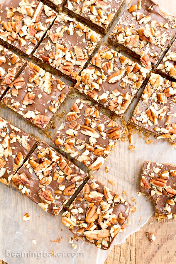 No Bake Paleo Chocolate Pecan Bars (V, GF, Paleo): a 5-ingredient, no bake recipe for deliciously textured pecan bars topped with a thick layer of chocolate and nuts. #Paleo #Vegan #GlutenFree #DairyFree | BeamingBaker.com