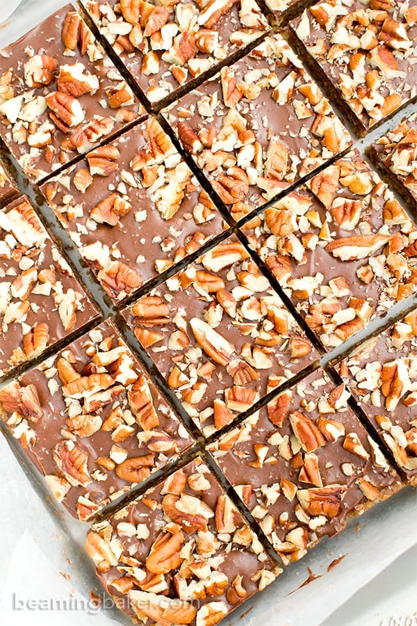 No Bake Paleo Chocolate Pecan Bars (V, GF, Paleo): a 5-ingredient, no bake recipe for deliciously textured pecan bars topped with a thick layer of chocolate and nuts. #Paleo #Vegan #GlutenFree #DairyFree | BeamingBaker.com