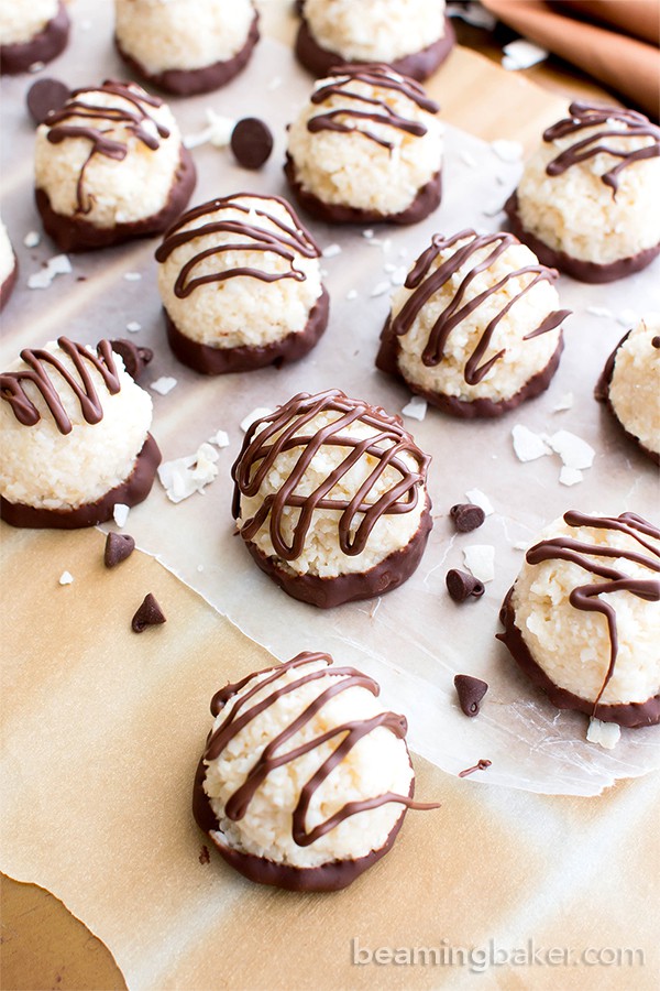 Vegan Coconut Truffles – Paleo Chocolate Coconut Balls! This gluten free dairy-free truffles recipe is easy! It’s the best 4-ingredient paleo coconut balls – dipped in chocolate, healthy. #Paleo #Vegan #GlutenFree #Coconut #DairyFree #Chocolate | Recipe at BeamingBaker.com