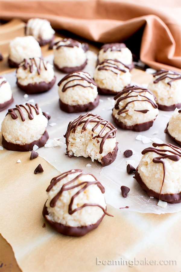 Vegan Coconut Truffles – Paleo Chocolate Coconut Balls! This gluten free dairy-free truffles recipe is easy! It’s the best 4-ingredient paleo coconut balls – dipped in chocolate, healthy. #Paleo #Vegan #GlutenFree #Coconut #DairyFree #Chocolate | Recipe at BeamingBaker.com