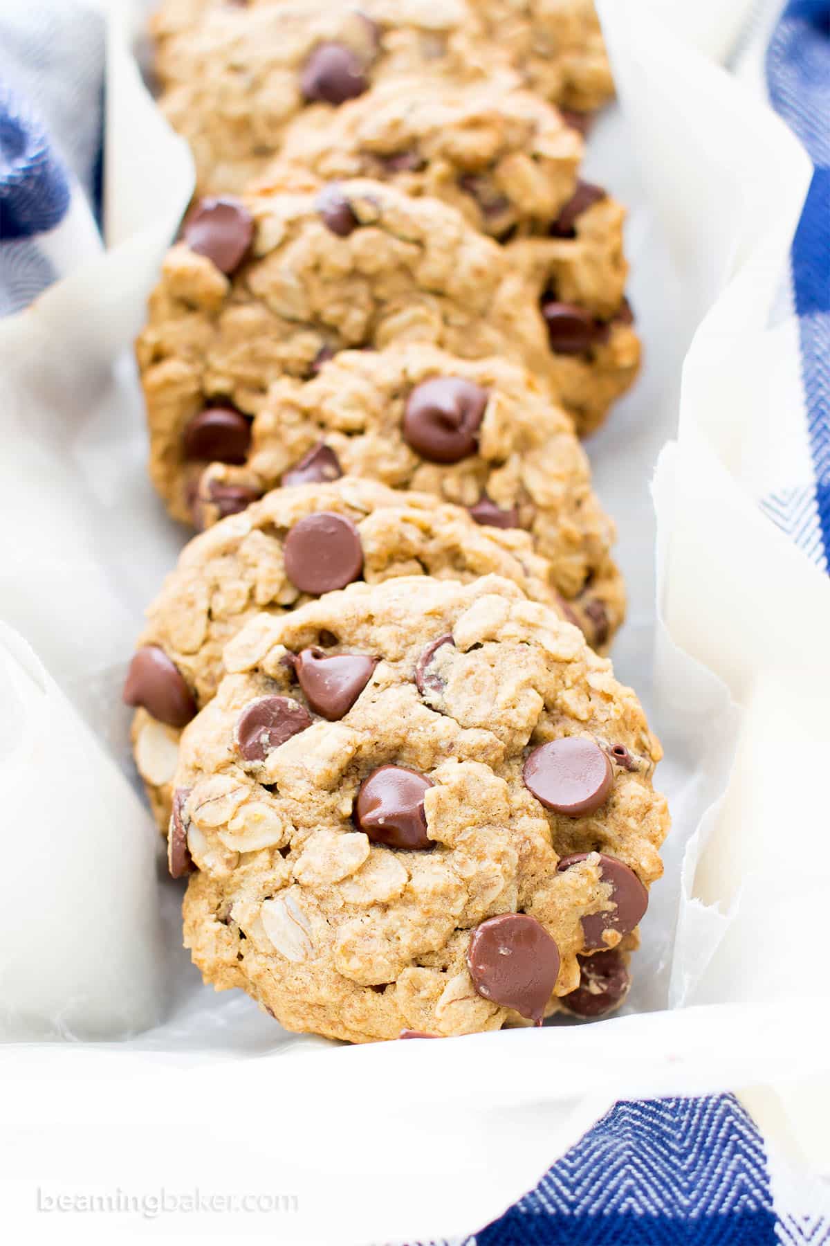 Gluten Free Vegan Oatmeal Chocolate Chip Cookies (GF): a simple vegan oatmeal chocolate chip cookies recipe that yields soft & buttery oatmeal cookies packed with melty chocolate chips! Dairy-Free, Refined Sugar-Free. #OatmealCookies #GlutenFree #Vegan #ChocolateChip | Recipe at BeamingBaker.com