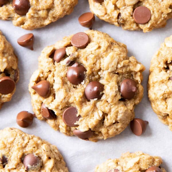 Gluten Free Vegan Oatmeal Chocolate Chip Cookies (GF): a simple vegan oatmeal chocolate chip cookies recipe that yields soft & buttery oatmeal cookies packed with melty chocolate chips! Dairy-Free, Refined Sugar-Free. #OatmealCookies #GlutenFree #Vegan #ChocolateChip | Recipe at BeamingBaker.com