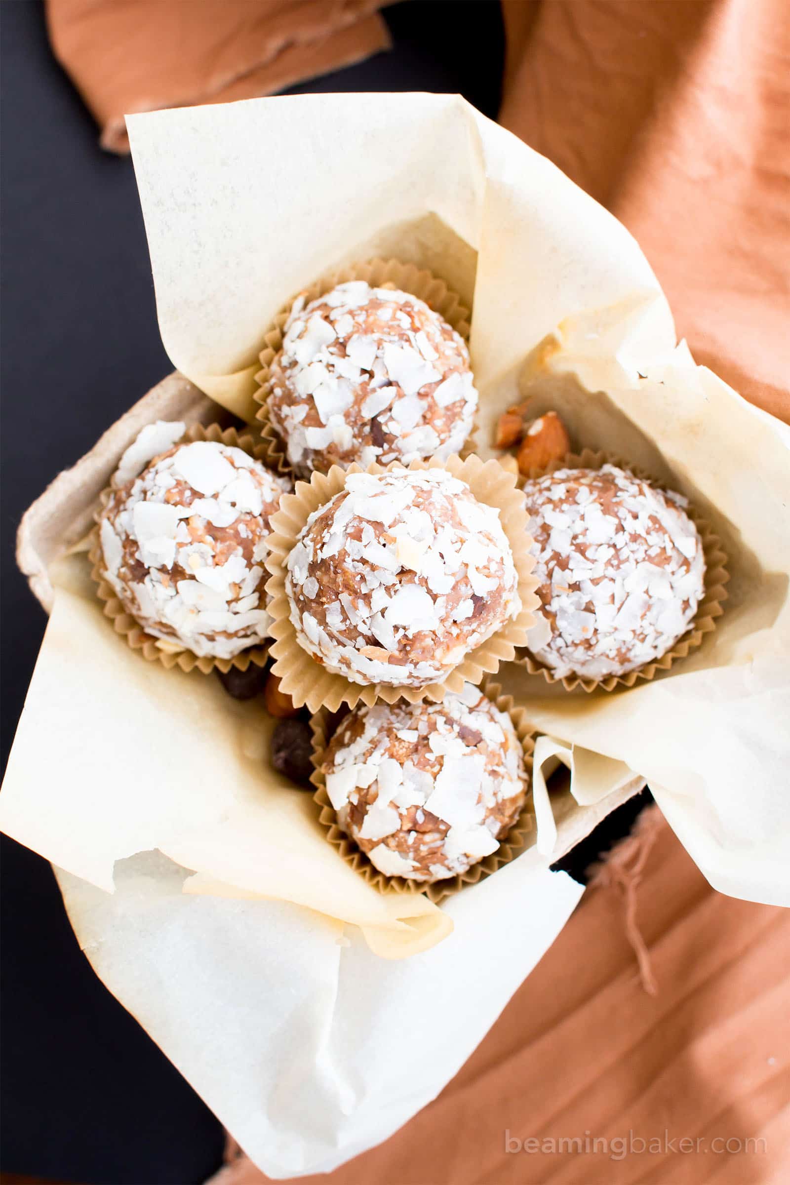 No Bake Gluten Free Almond Joy Energy Bites (V, GF, DF): a one bowl recipe for protein-packed energy bites bursting with Almond Joy flavors, made with simple ingredients. #Vegan #GlutenFree #DairyFree | BeamingBaker.com