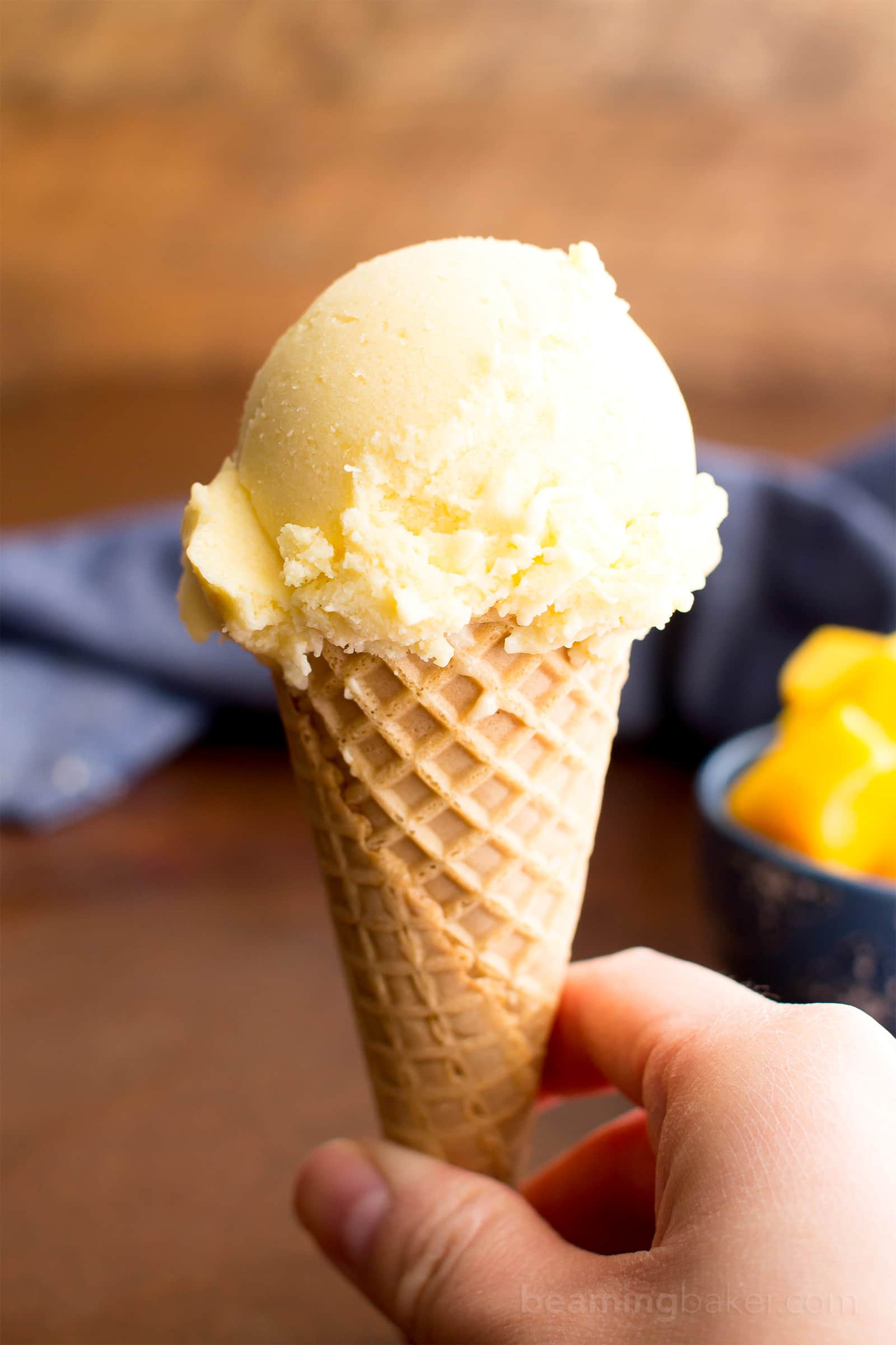 Homemade Mango Ice Cream: this 3 ingredient mango ice cream recipe is super EASY! 5 mins of prep for the best mango ice cream: rich & creamy with big mango flavor! Vegan, Dairy-Free, Healthy. #Mango #IceCream #Vegan #DairyFree | Recipe at BeamingBaker.com