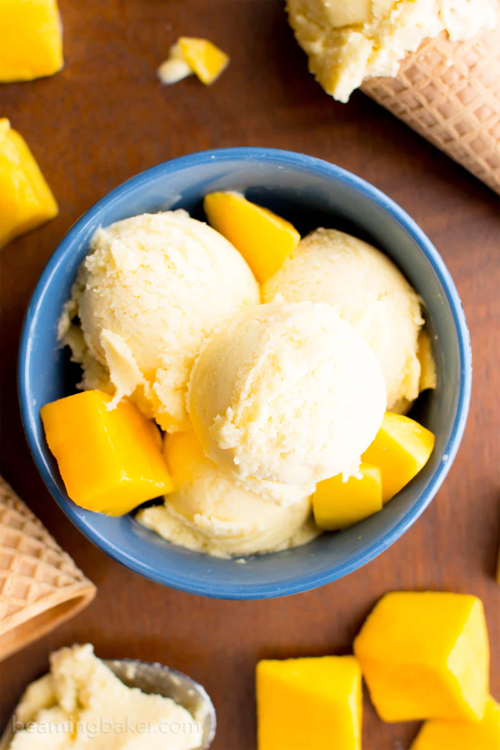 Homemade Mango Ice Cream: this 3 ingredient mango ice cream recipe is super EASY! 5 mins of prep for the best mango ice cream: rich & creamy with big mango flavor! Vegan, Dairy-Free, Healthy. #Mango #IceCream #Vegan #DairyFree | Recipe at BeamingBaker.com