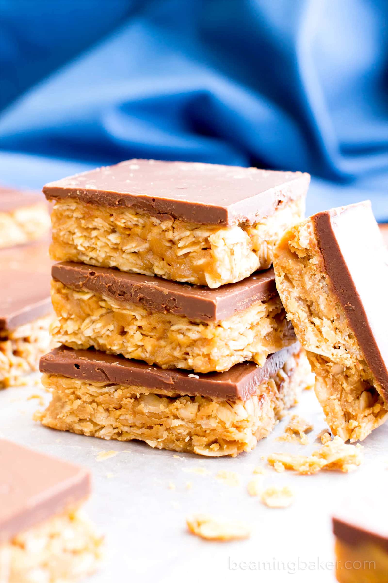4 Ingredient No Bake Chocolate Peanut Butter Cup Granola Bars (GF, V): an easy, protein-rich recipe for decadent PB granola bars covered in chocolate, made with whole ingredients. #Vegan #ProteinPacked #GlutenFree #DairyFree #WholeGrain | BeamingBaker.com
