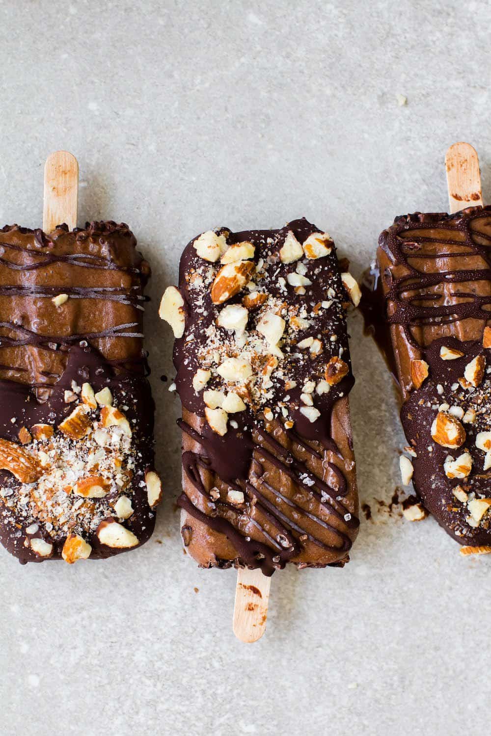 15 Healthy Frozen Desserts Made in a Popsicle Mold (V, DF, Paleo): a frozen dessert collection of dairy-free, paleo and vegan treats made with a popsicle mold! #Vegan #Paleo #DairyFree #GlutenFree | BeamingBaker.com