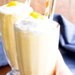 3 Ingredient Mango Coconut Paleo Milkshake (V, GF, Paleo): an easy, 3 ingredient recipe for super thick and frosty mango coconut milkshakes! #Paleo #Vegan #DairyFree #GlutenFree | BeamingBaker.com