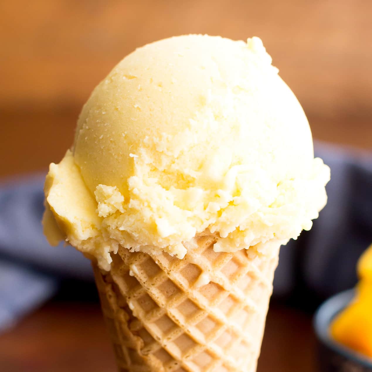 Homemade Mango Ice Cream: this 3 ingredient mango ice cream recipe is super EASY! 5 mins of prep for the best mango ice cream: rich & creamy with big mango flavor! Vegan, Dairy-Free, Healthy. #Mango #IceCream #Vegan #DairyFree | Recipe at BeamingBaker.com