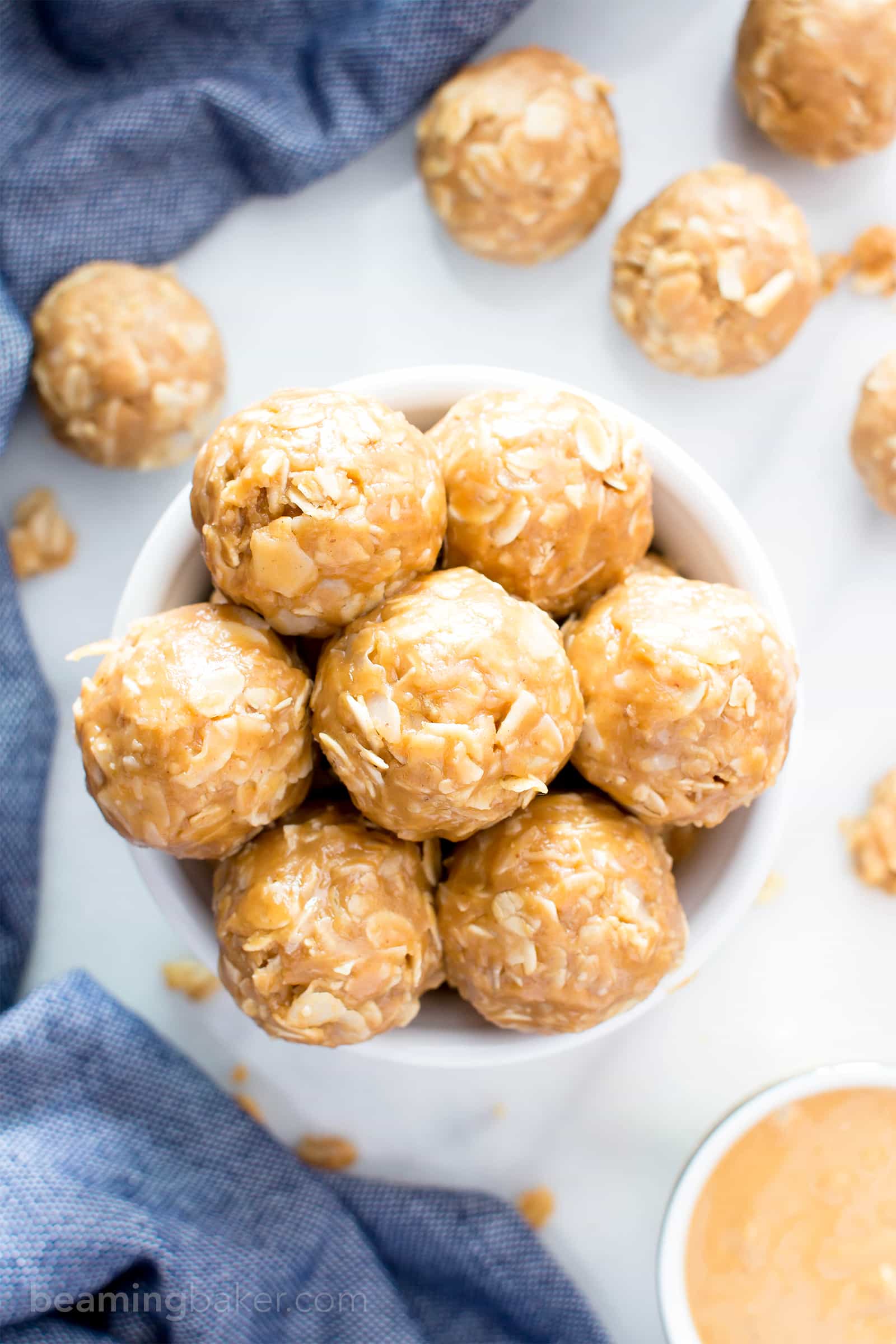 4 Ingredient No Bake Peanut Butter Coconut Energy Bites (V, GF): a quick ‘n easy One Bowl recipe for tasty protein-packed energy bites bursting with peanut butter and coconut! #Vegan #ProteinRich #GlutenFree #DairyFree #WholeGrain | BeamingBaker.com