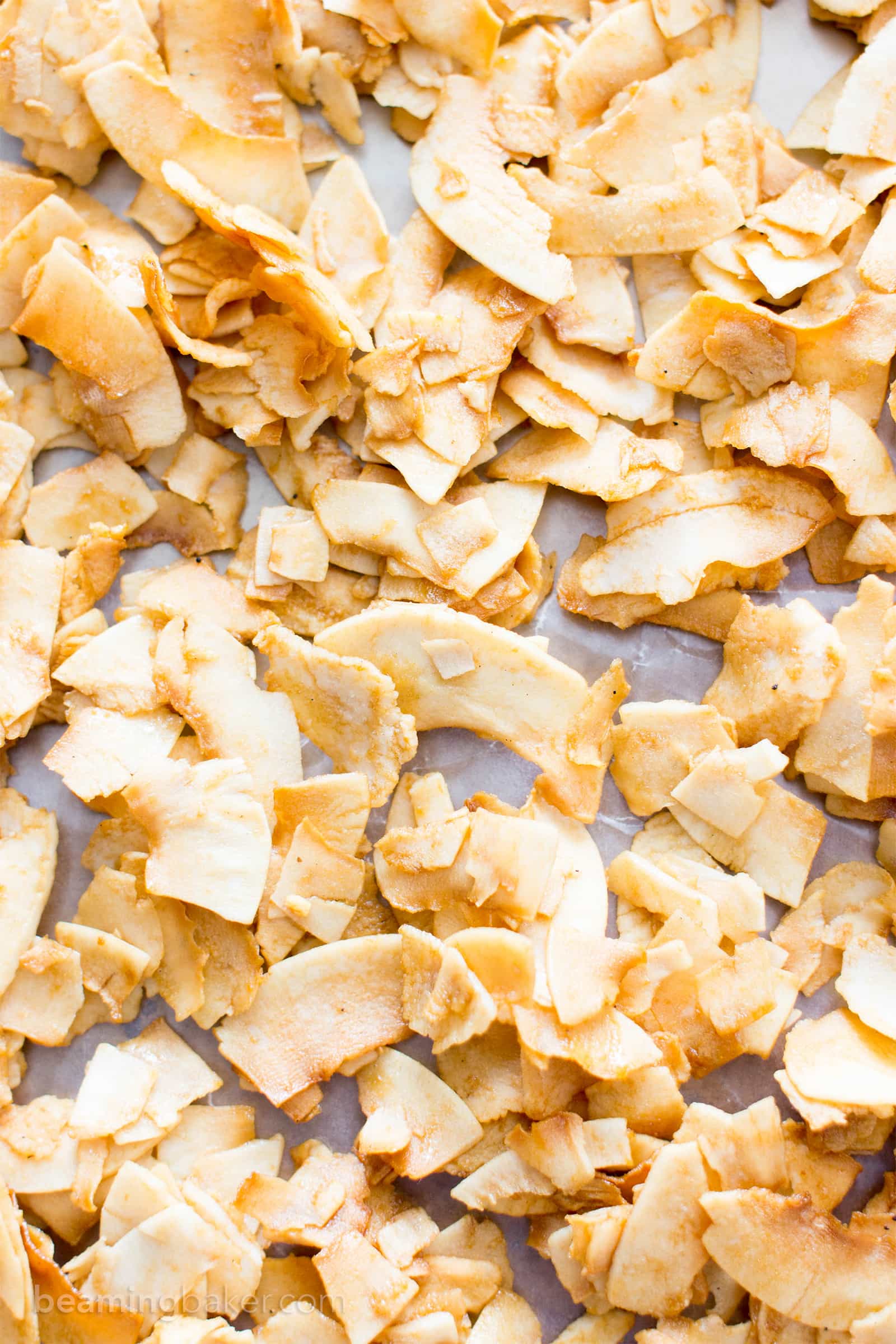 4 Ingredient Salted Caramel Toasted Coconut Chips (V, GF, Paleo): an easy, 5-minute prep recipe for crispy, salty ‘n sweet coconut chips caramelized to perfection. #Paleo #Vegan #GlutenFree #RefinedSugarFree #DairyFree | BeamingBaker.com