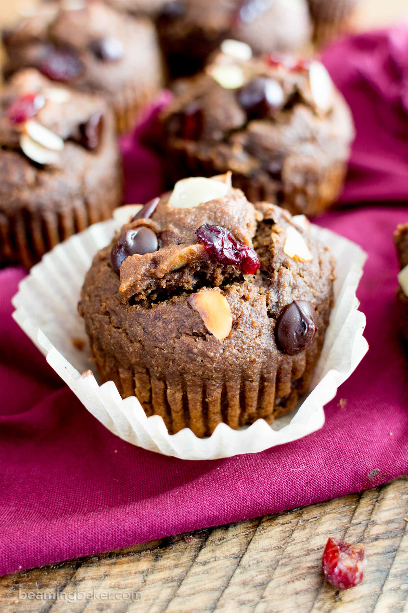 Chocolate Cranberry Almond Banana Muffins Recipe (V, GF): delightfully warm and cozy chocolate banana muffins packed with juicy cranberries and almonds. #Vegan #GlutenFree #DairyFree #Healthy #OneBowl | BeamingBaker.com