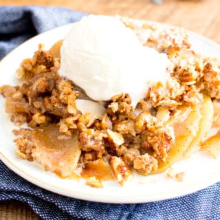 Paleo Apple Pecan Coconut Crisp Recipe (V, GF): a super crisp, nutty topping blanketing a warm, apple cinnamon filling with gooey caramelized coating. #Vegan #Paleo #GlutenFree #DairyFree #Healthy #Fall | BeamingBaker.com