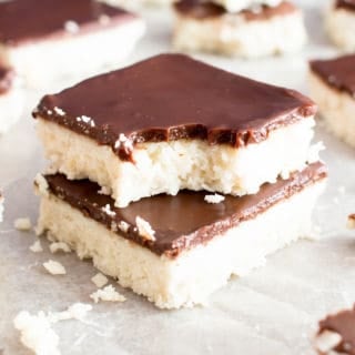 5 Ingredient No Bake Chocolate Coconut Bars (V, GF): A decadent 'n easy dessert recipe for thick, indulgent coconut bars enrobed in a velvety layer of rich chocolate ganache. Healthy Dessert Recipe. #Vegan  #GlutenFree  #Paleo #Healthy #Desserts #DairyFree | Recipe on BeamingBaker.com