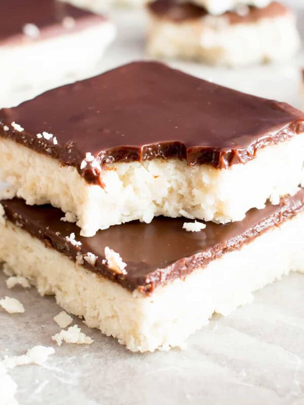 5 Ingredient No Bake Chocolate Coconut Bars (V, GF): A decadent 'n easy dessert recipe for thick, indulgent coconut bars enrobed in a velvety layer of rich chocolate ganache. Healthy Dessert Recipe. #Vegan  #GlutenFree  #Paleo #Healthy #Desserts #DairyFree | Recipe on BeamingBaker.com