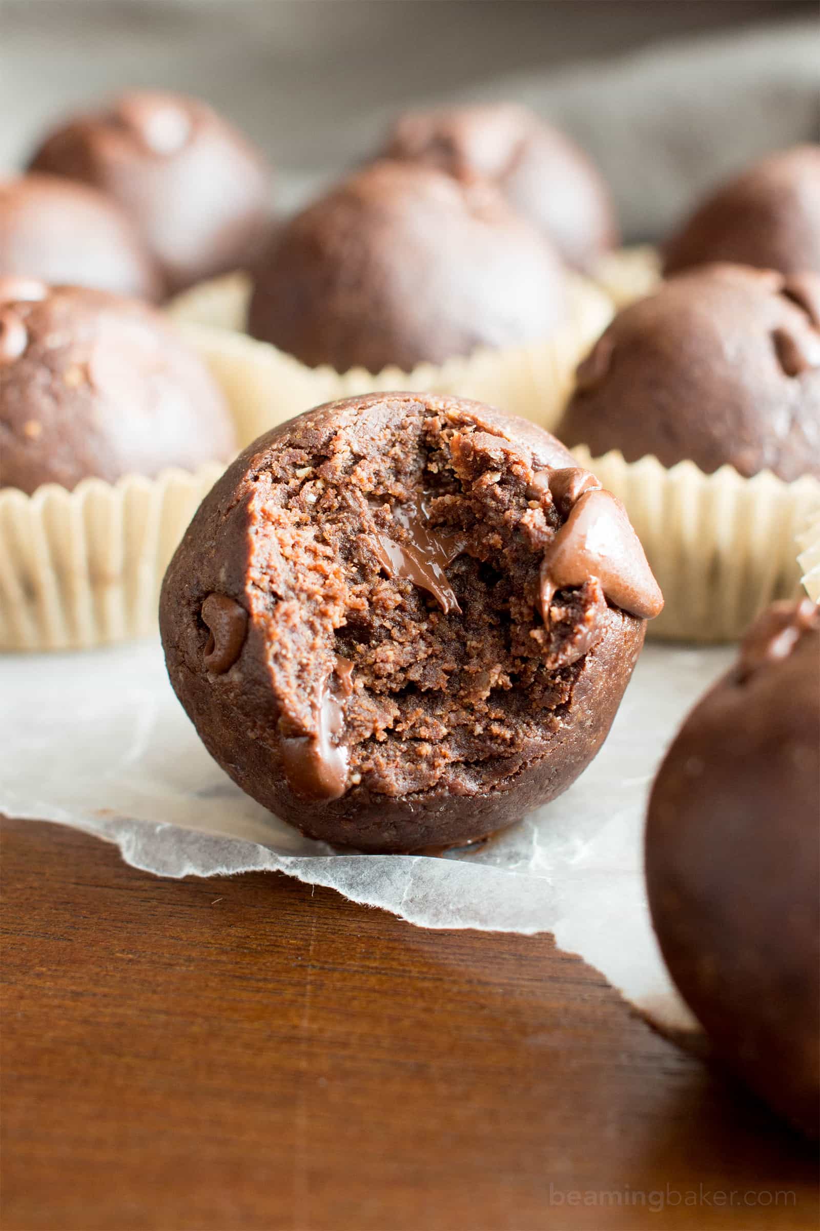 No Bake Almond Butter Paleo Brownie Bites (V, GF): Melt in your mouth fudgy paleo brownie bites that taste like a bite of pure chocolate. #Vegan #Paleo #DairyFree #GlutenFree #Chocolate | Recipe on BeamingBaker.com