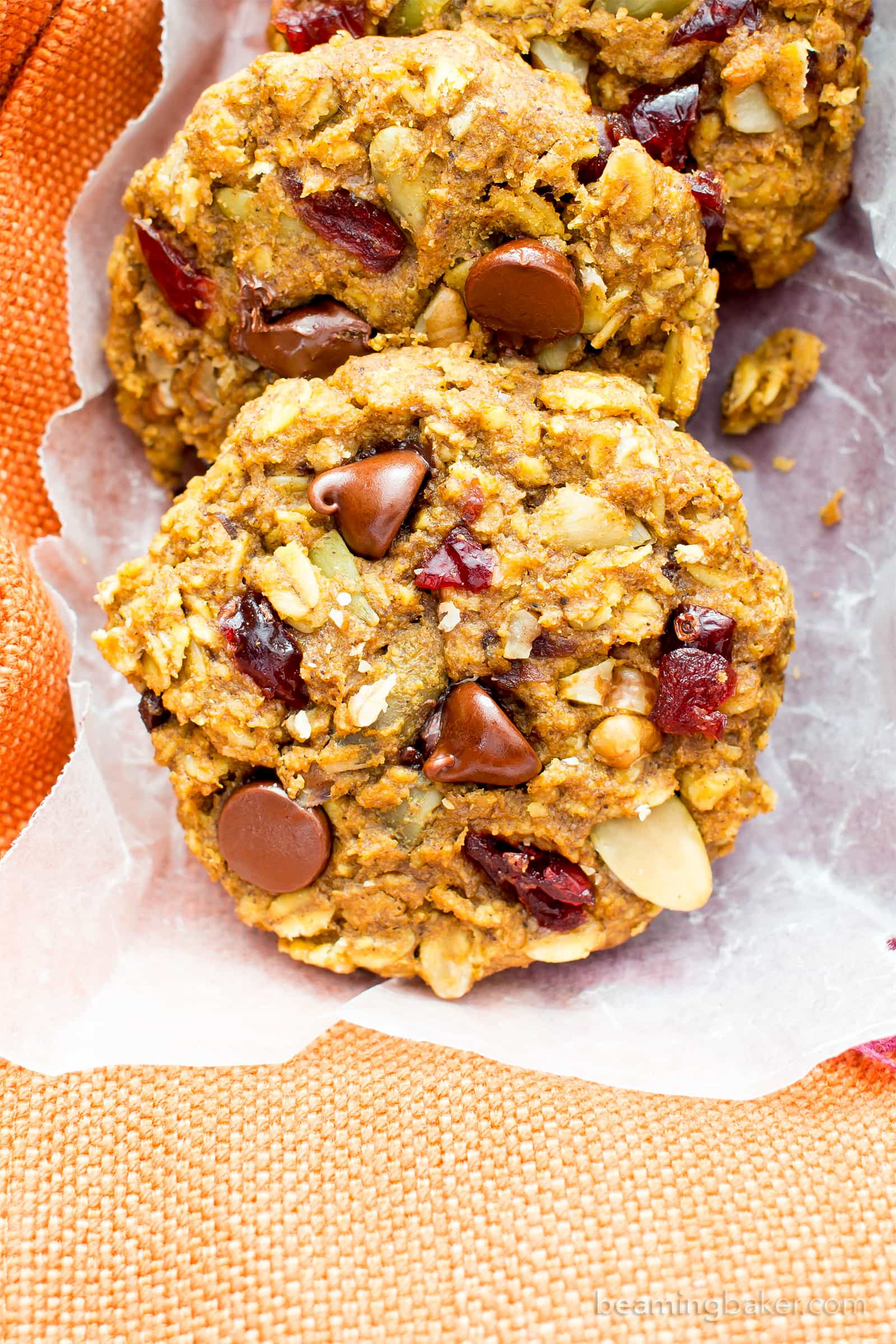 Pumpkin Chocolate Chip Oatmeal Breakfast Cookies (V, GF): Soft, chewy pumpkin oatmeal cookies packed with chocolate chips and pumpkin seeds. Perfect for breakfast or an afternoon treat! #Vegan #GlutenFree #DairyFree #Cookies #Baking #Breakfast | Recipe on BeamingBaker.com