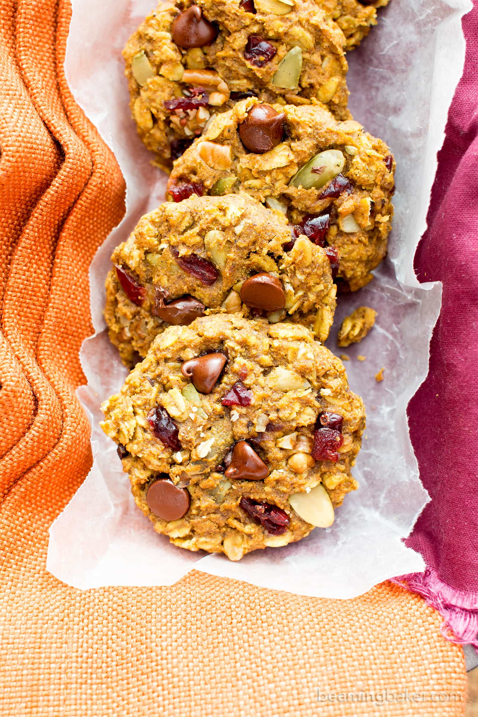 Pumpkin Chocolate Chip Oatmeal Breakfast Cookies (V, GF): Soft, chewy pumpkin oatmeal cookies packed with chocolate chips and pumpkin seeds. Perfect for breakfast or an afternoon treat! #Vegan #GlutenFree #DairyFree #Cookies #Baking #Breakfast | Recipe on BeamingBaker.com