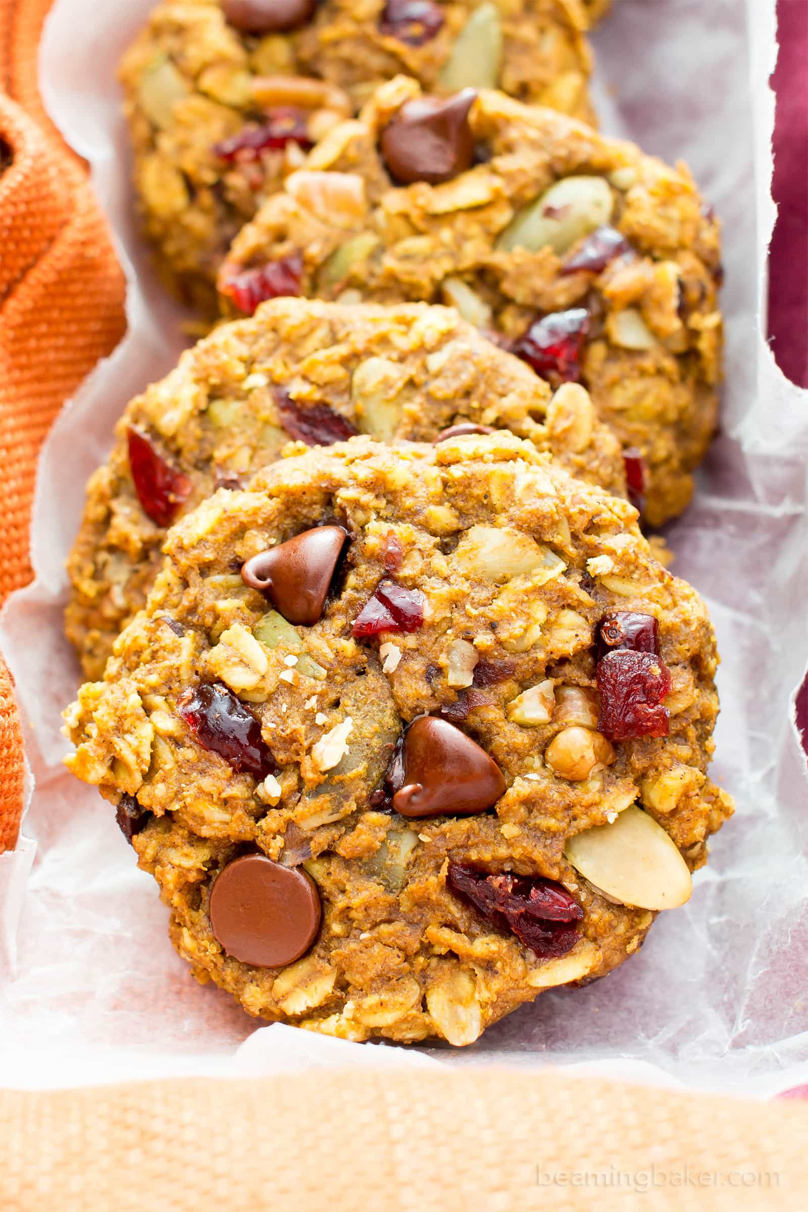 Pumpkin Chocolate Chip Oatmeal Breakfast Cookies (V, GF): Soft, chewy pumpkin oatmeal cookies packed with chocolate chips and pumpkin seeds. Perfect for breakfast or an afternoon treat! #Vegan #GlutenFree #DairyFree #Cookies #Baking #Breakfast | Recipe on BeamingBaker.com