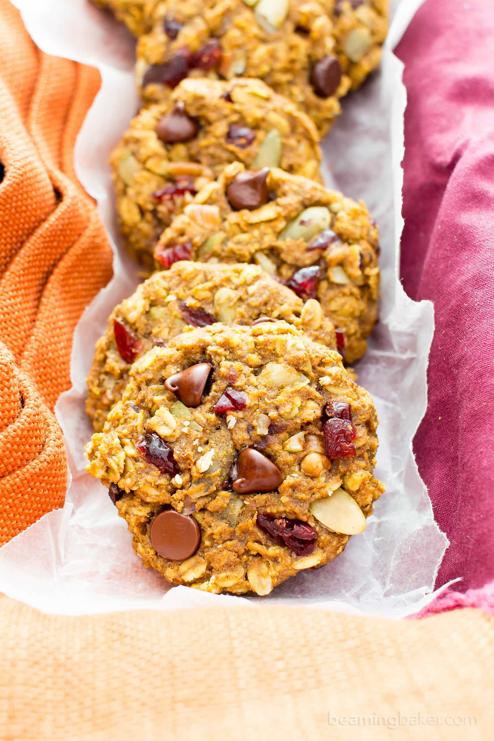 Pumpkin Chocolate Chip Oatmeal Breakfast Cookies (V, GF): Soft, chewy pumpkin oatmeal cookies packed with chocolate chips and pumpkin seeds. Perfect for breakfast or an afternoon treat! #Vegan #GlutenFree #DairyFree #Cookies #Baking #Breakfast | Recipe on BeamingBaker.com