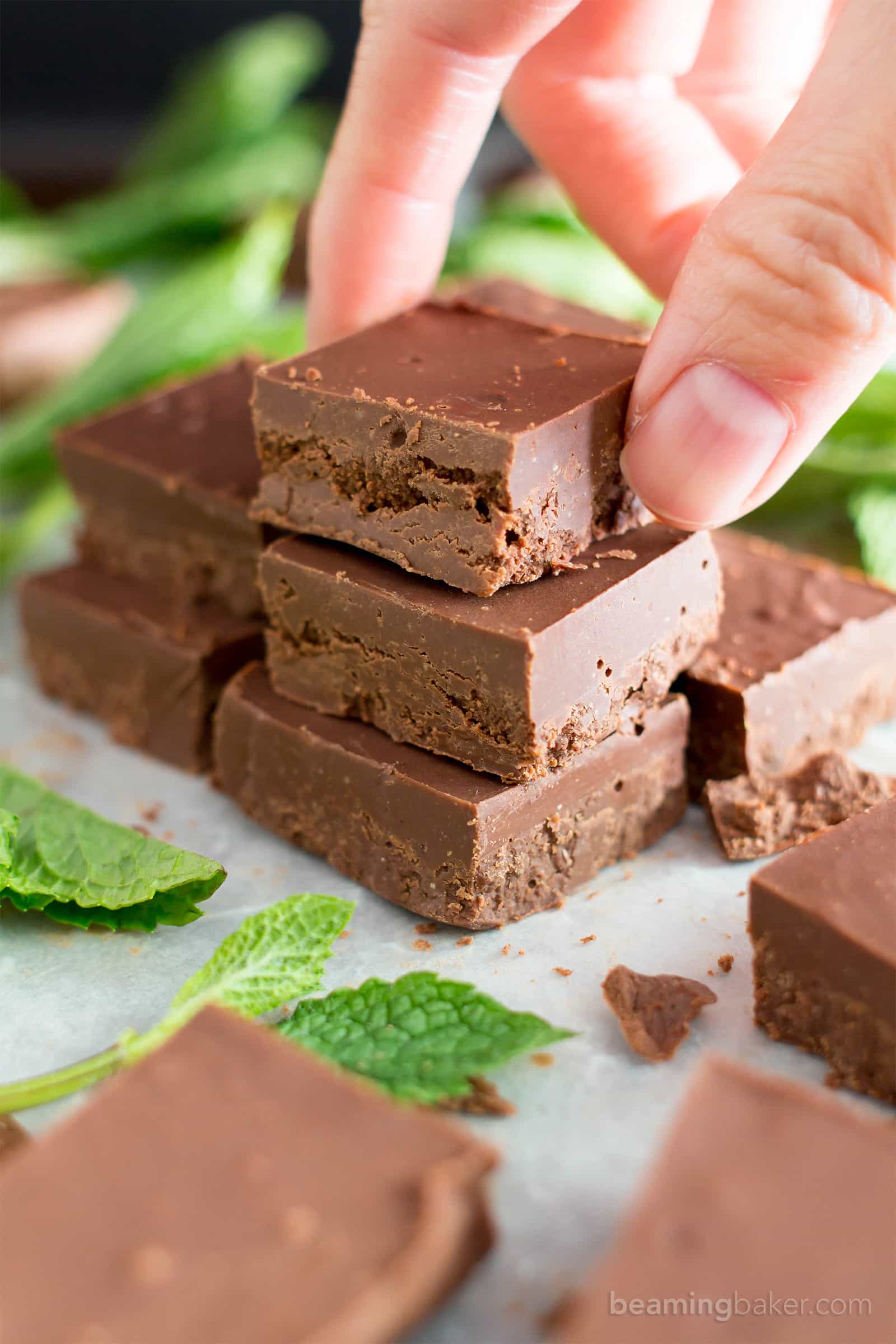 5 Minute Easy Peppermint Fudge (V, GF): a 3 ingredient recipe for creamy, thick indulgent chocolatey fudge squares made with healthy ingredients! #Paleo #Vegan #GlutenFree #DairyFree #HealthyHolidayDesserts | Recipe on BeamingBaker.com