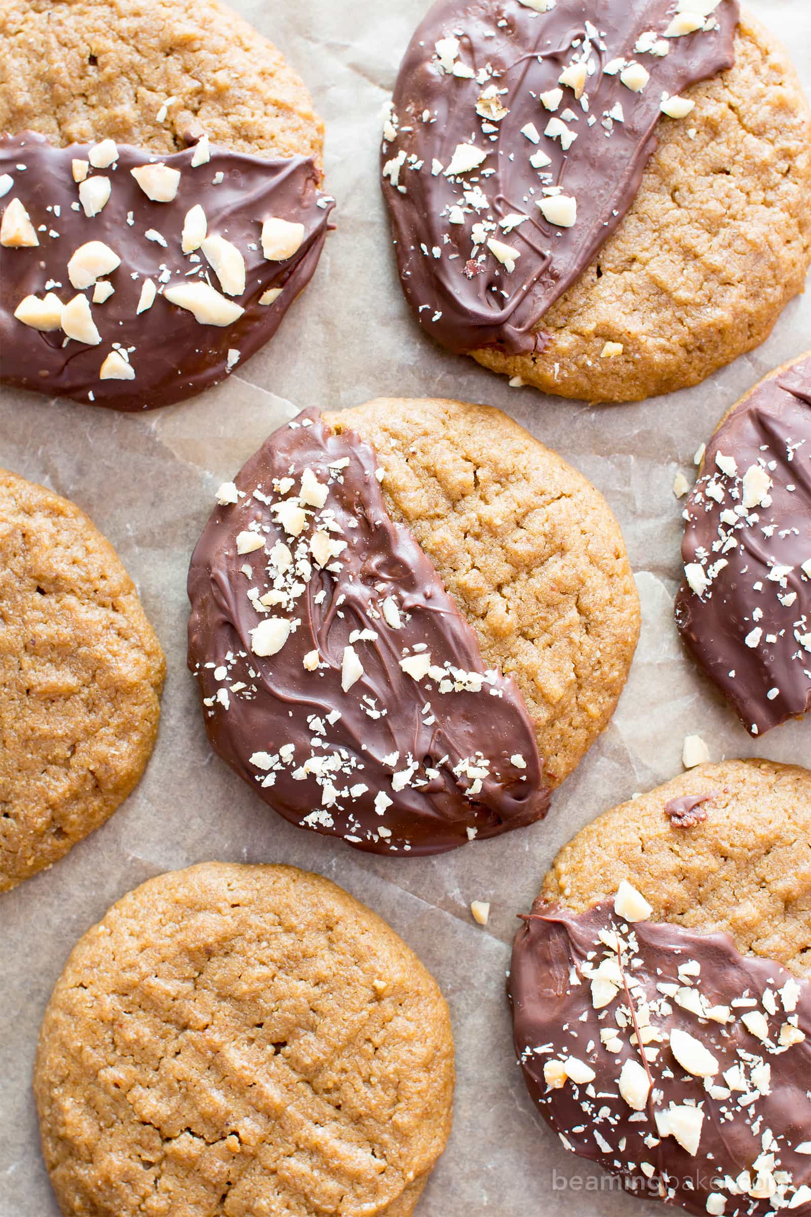 Chocolate Covered Peanut Butter Cookies (V, GF): an easy recipe for soft ‘n chewy peanut butter cookies wrapped in a velvety layer of chocolate and topped with crunchy peanuts. #Vegan #Desserts #GlutenFree #DairyFree #Healthy #Holiday | Recipe on BeamingBaker.com