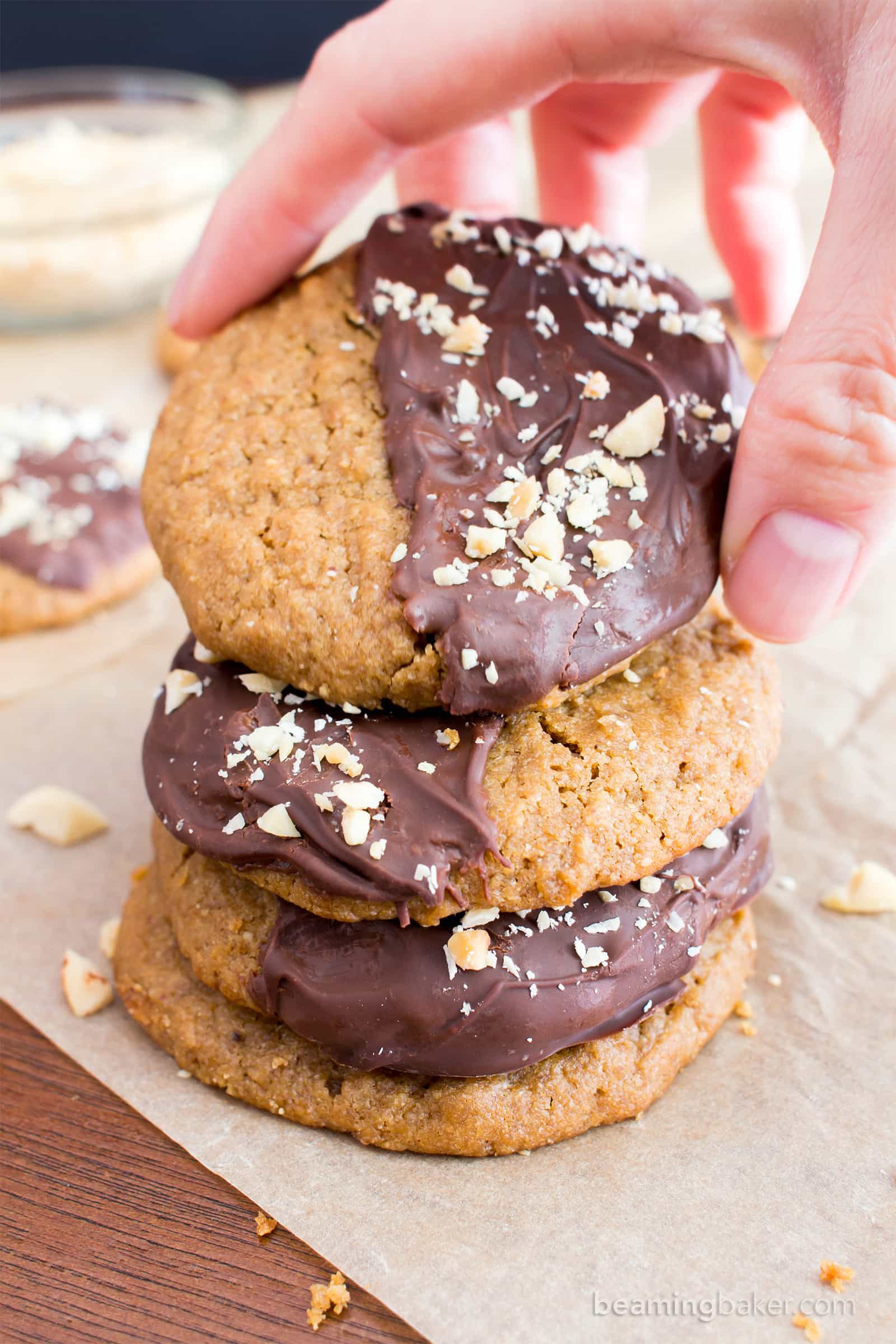 Chocolate Covered Peanut Butter Cookies (V, GF): an easy recipe for soft ‘n chewy peanut butter cookies wrapped in a velvety layer of chocolate and topped with crunchy peanuts. #Vegan #Desserts #GlutenFree #DairyFree #Healthy #Holiday | Recipe on BeamingBaker.com
