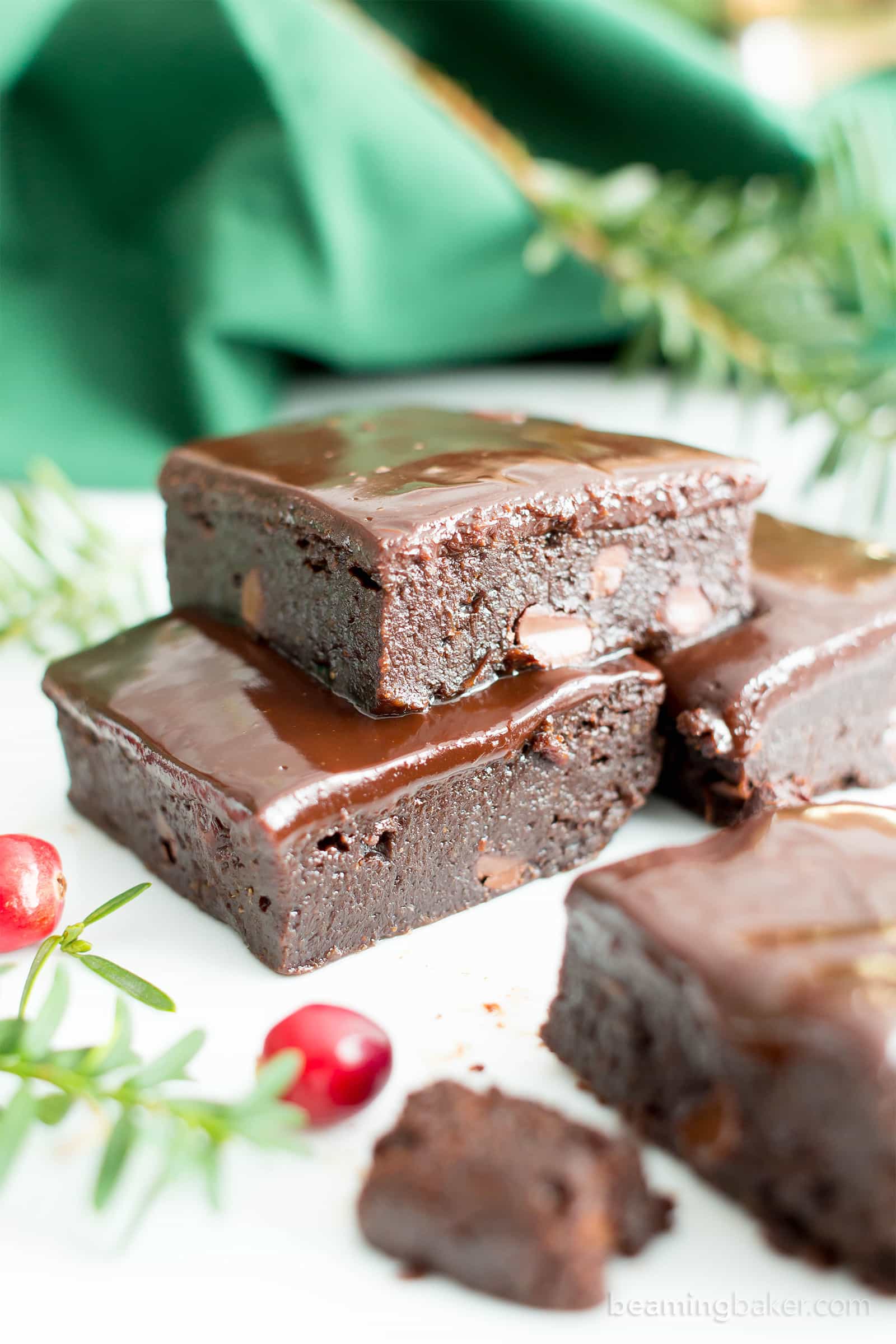 Moist & Fudgy Ganache Peppermint Brownies Recipe (V, GF): an easy recipe for indulgently fudgy, cool mint brownies topped with silky smooth chocolate ganache made with healthy ingredients. #Vegan #GlutenFree #DairyFree #HealthyHolidayDesserts #Desserts | Recipe on BeamingBaker.com