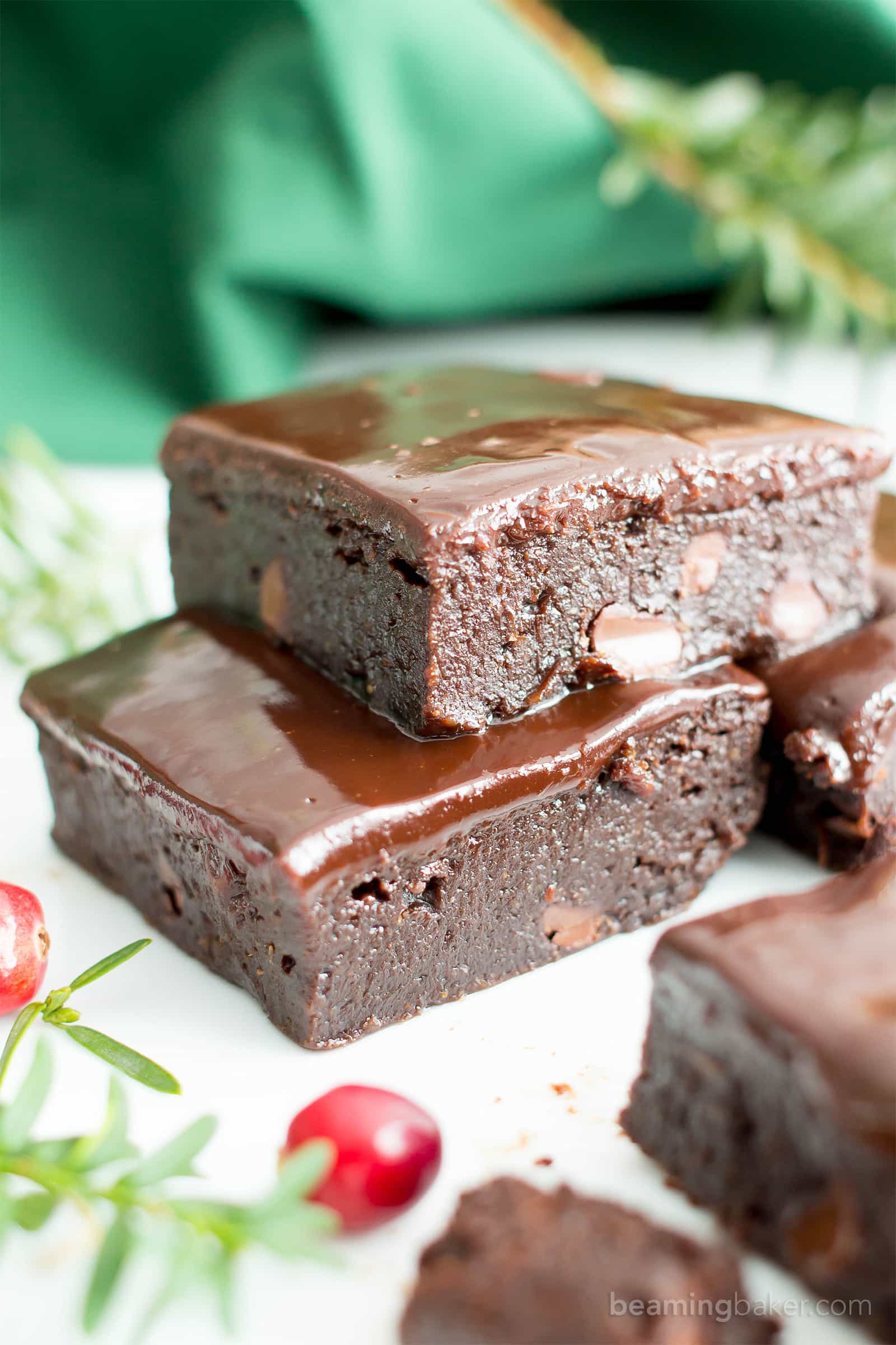 Moist & Fudgy Ganache Peppermint Brownies Recipe (V, GF): an easy recipe for indulgently fudgy, cool mint brownies topped with silky smooth chocolate ganache made with healthy ingredients. #Vegan #GlutenFree #DairyFree #HealthyHolidayDesserts #Desserts | Recipe on BeamingBaker.com