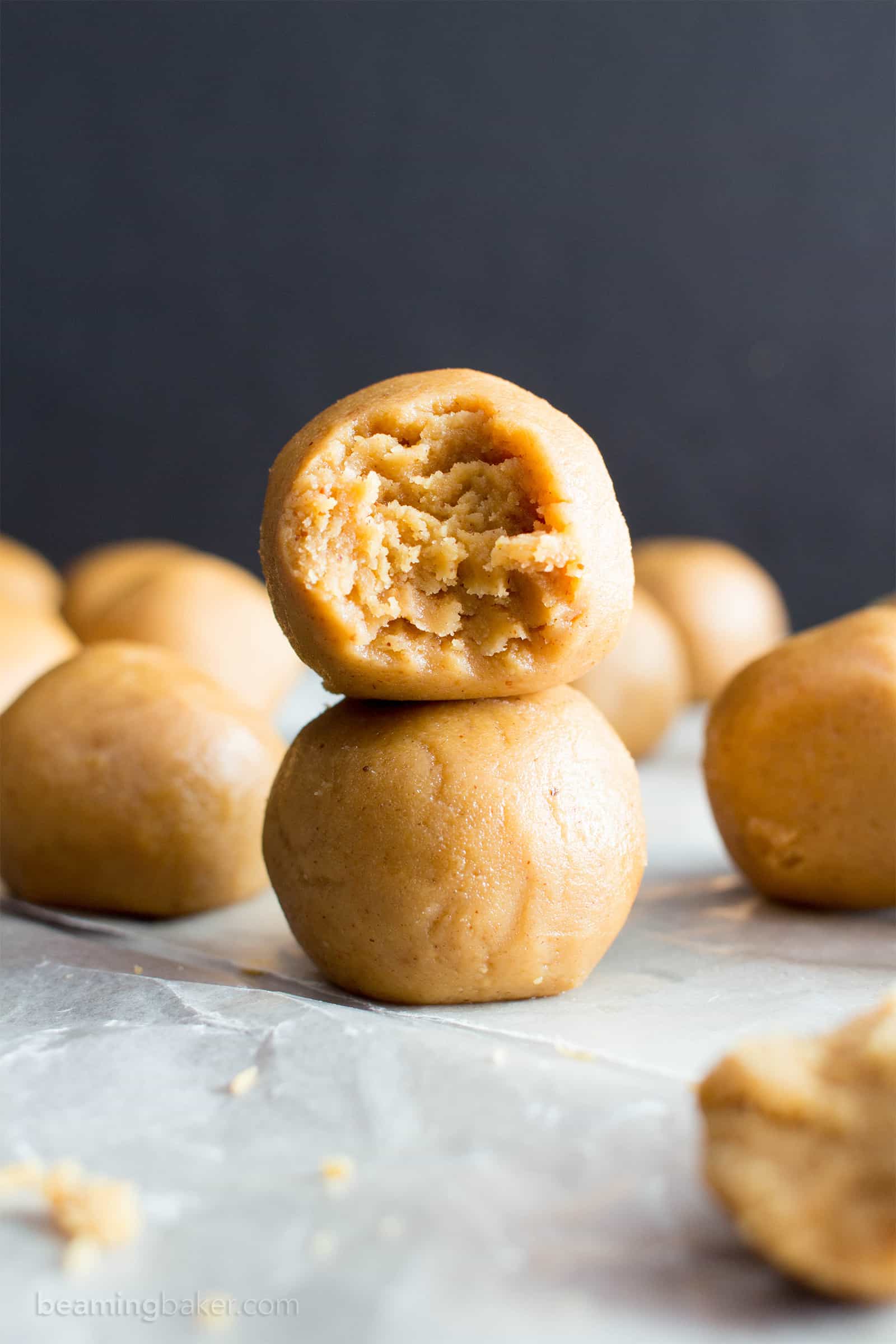 No Bake Peanut Butter Balls: just 3 ingredients for the best peanut butter bites—no bake, easy to make, simple & healthy ingredients. Soft and delicious no bake peanut butter balls. Vegan. #NoBake #PeanutButter #NoBakeBalls #NoBakeBites #EnergyBites #EnergyBalls | Recipe at BeamingBaker.com