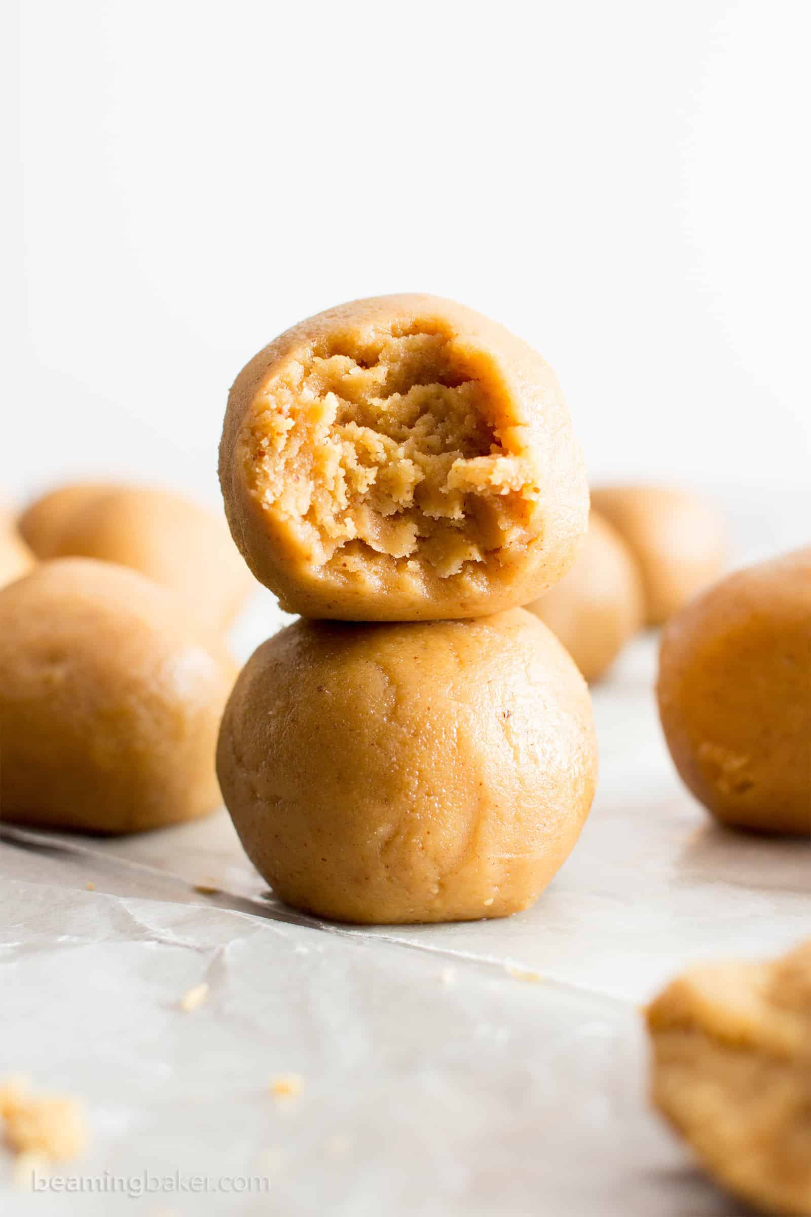 No Bake Peanut Butter Balls: just 3 ingredients for the best peanut butter bites—no bake, easy to make, simple & healthy ingredients. Soft and delicious no bake peanut butter balls. Vegan. #NoBake #PeanutButter #NoBakeBalls #NoBakeBites #EnergyBites #EnergyBalls | Recipe at BeamingBaker.com