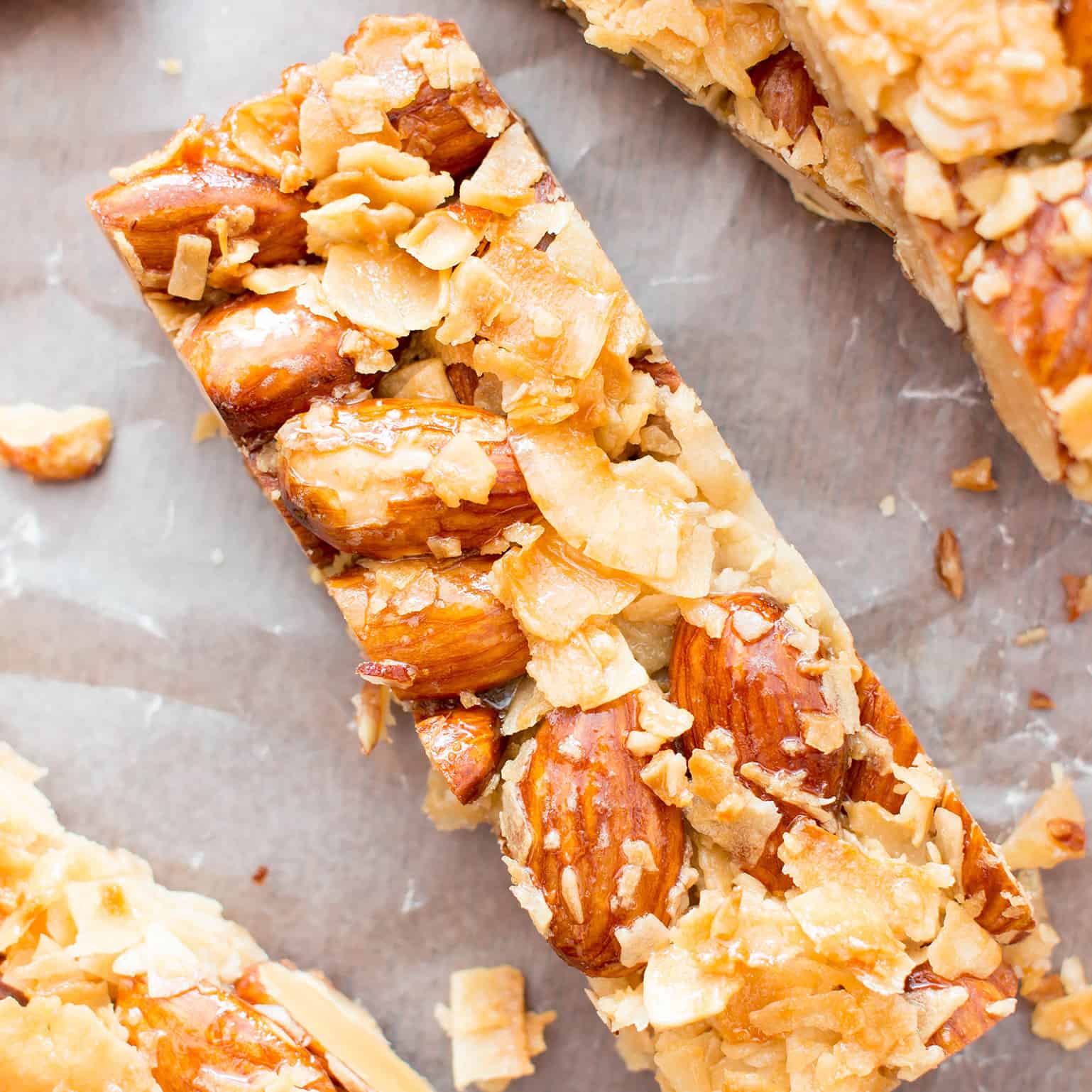 3 Ingredient Homemade KIND Coconut Almond Bar Recipe (V, GF): an easy recipe for homemade paleo KIND bars packed with crunchy almonds and sweet coconut. #Paleo #Vegan #GlutenFree #DairyFree #Healthy #Snacks | Recipe on BeamingBaker.com 