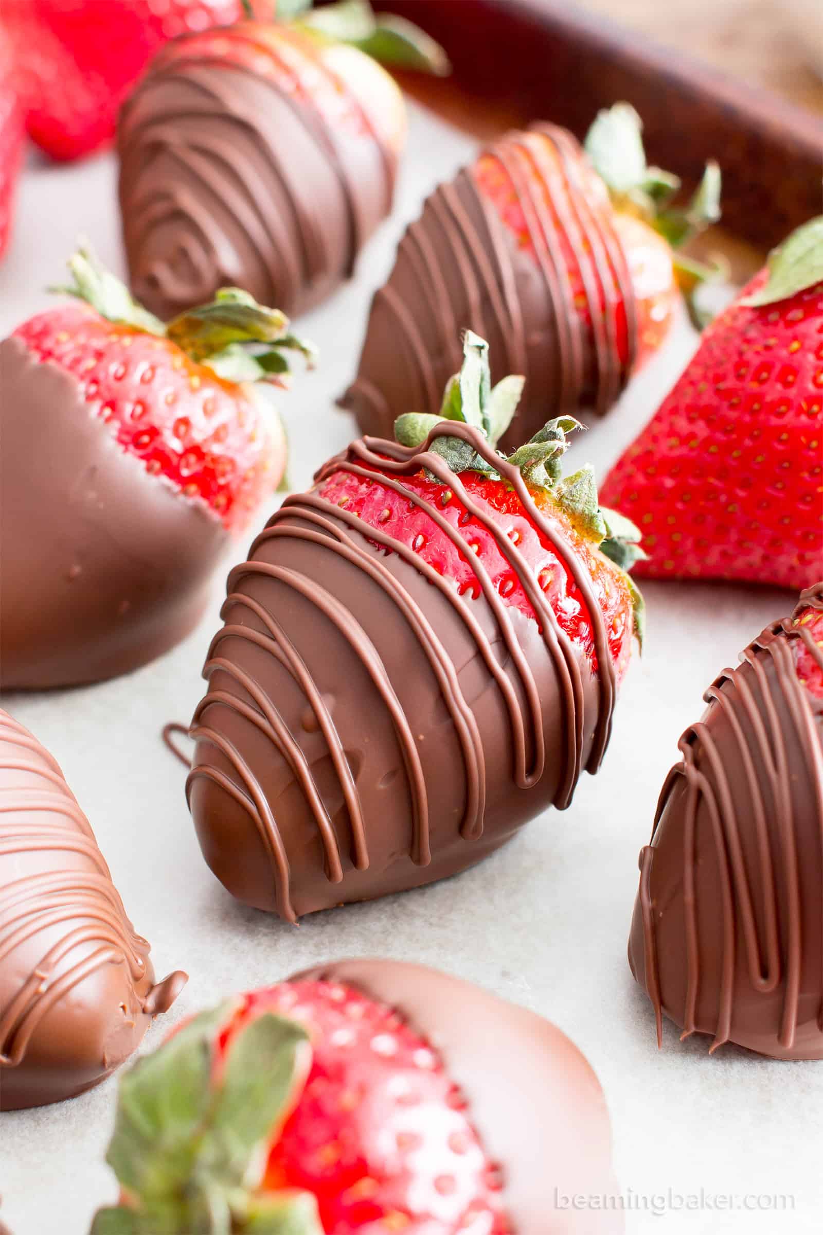 Tray of chocolate dipped strawberries with chocolate drizzle