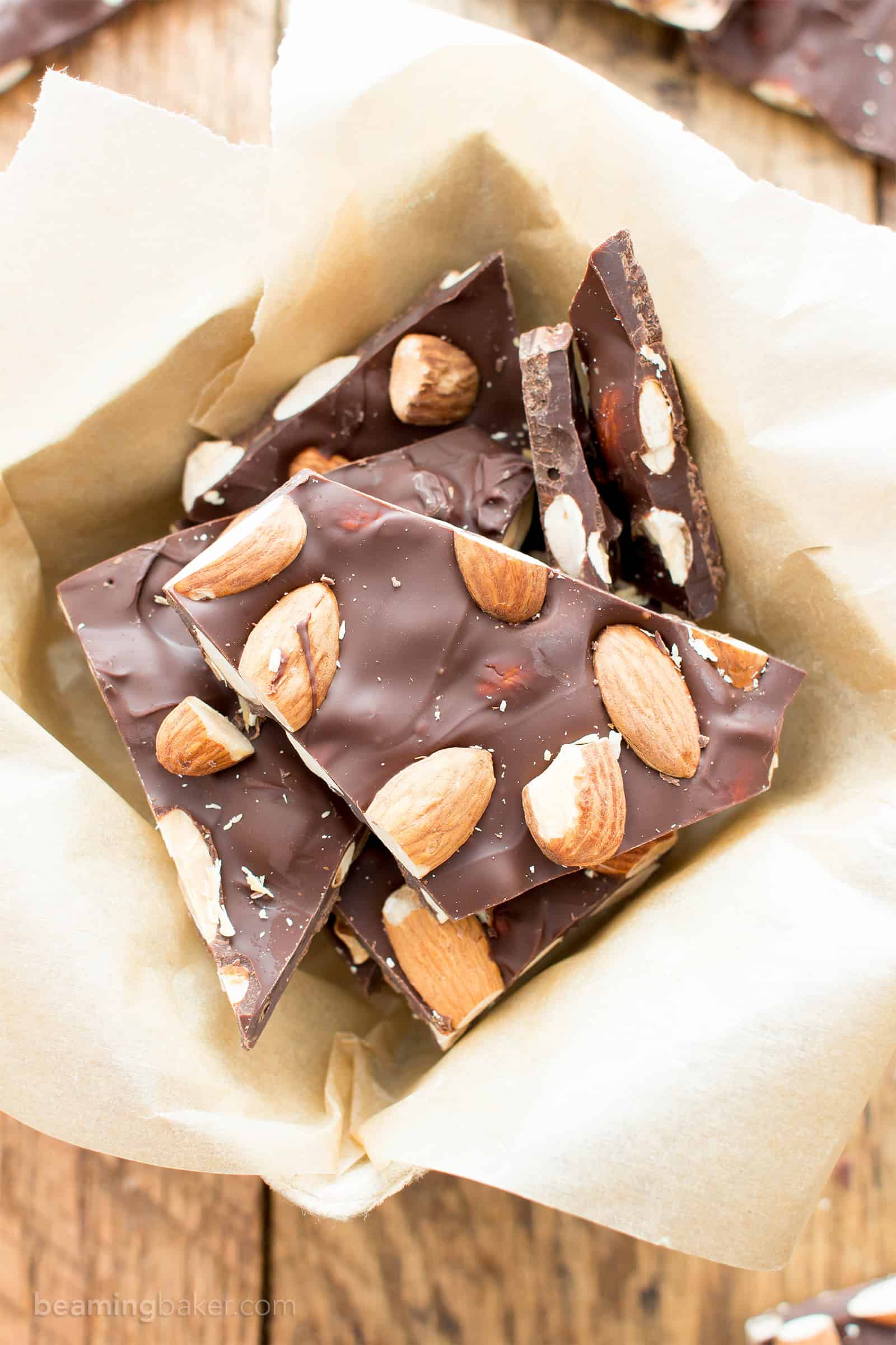 3 Ingredient Chocolate Almond Bark Recipe (V, GF): a fun recipe for thick pieces of indulgent chocolate bark perfectly packed with almonds. #Vegan #Paleo #GlutenFree #DairyFree #Dessert #Candy | Recipe on BeamingBaker.com