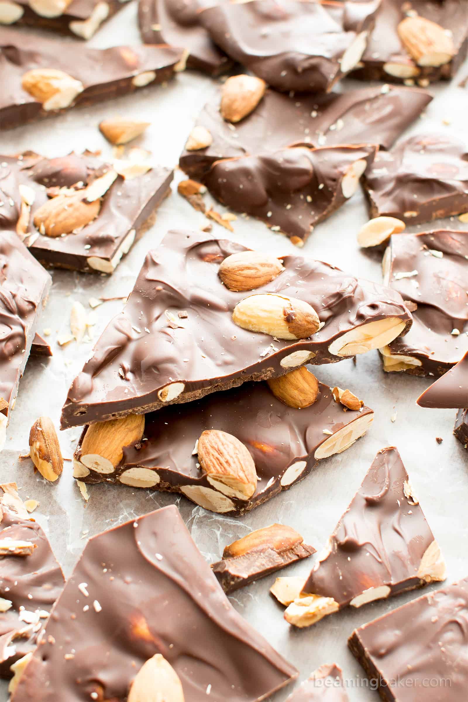 3 Ingredient Chocolate Almond Bark Recipe (V, GF): a fun recipe for thick pieces of indulgent chocolate bark perfectly packed with almonds. #Vegan #Paleo #GlutenFree #DairyFree #Dessert #Candy | Recipe on BeamingBaker.com