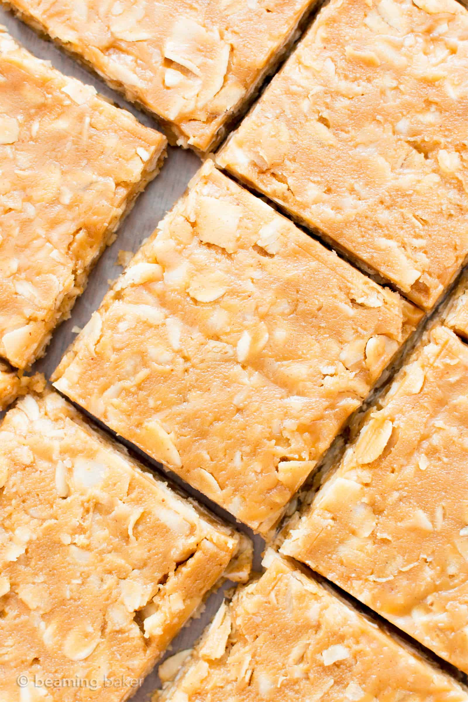 4 Ingredient No Bake Peanut Butter Coconut Oatmeal Bars (V, GF): an easy, one bowl recipe for protein-rich, gluten-free oatmeal bars bursting with peanut butter and coconut. #Vegan #GlutenFree #DairyFree #HealthySnacks #ProteinRich #RefinedSugarFree #PlantBased | Recipe on BeamingBaker.com