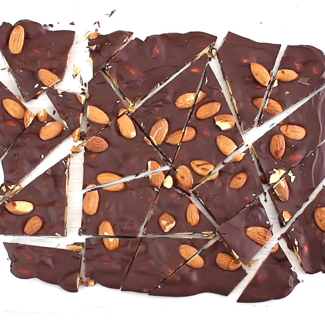 fully chopped pieces of chocolate almond bark on parchment paper