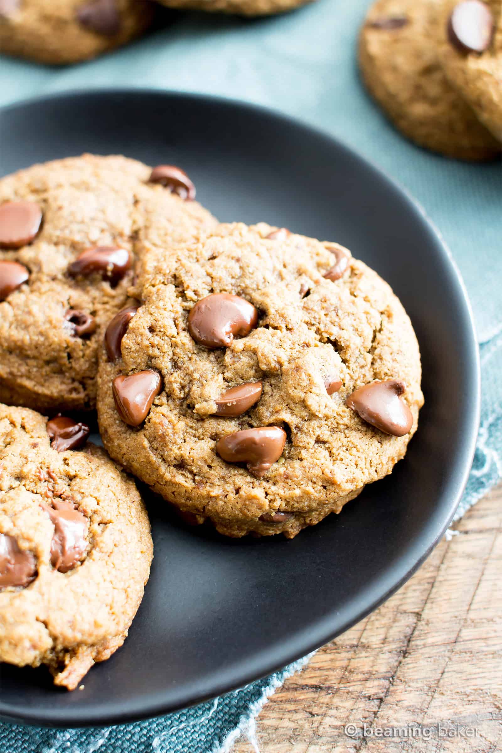 Vegan Chocolate Chip Cookies Recipe (V, GF): Chewy on the inside, crispy on the edges, and packed with rich chocolate. My favorite chocolate chip cookies! #Vegan #GlutenFree #DairyFree #Cookies #Dessert | Recipe on BeamingBaker.com