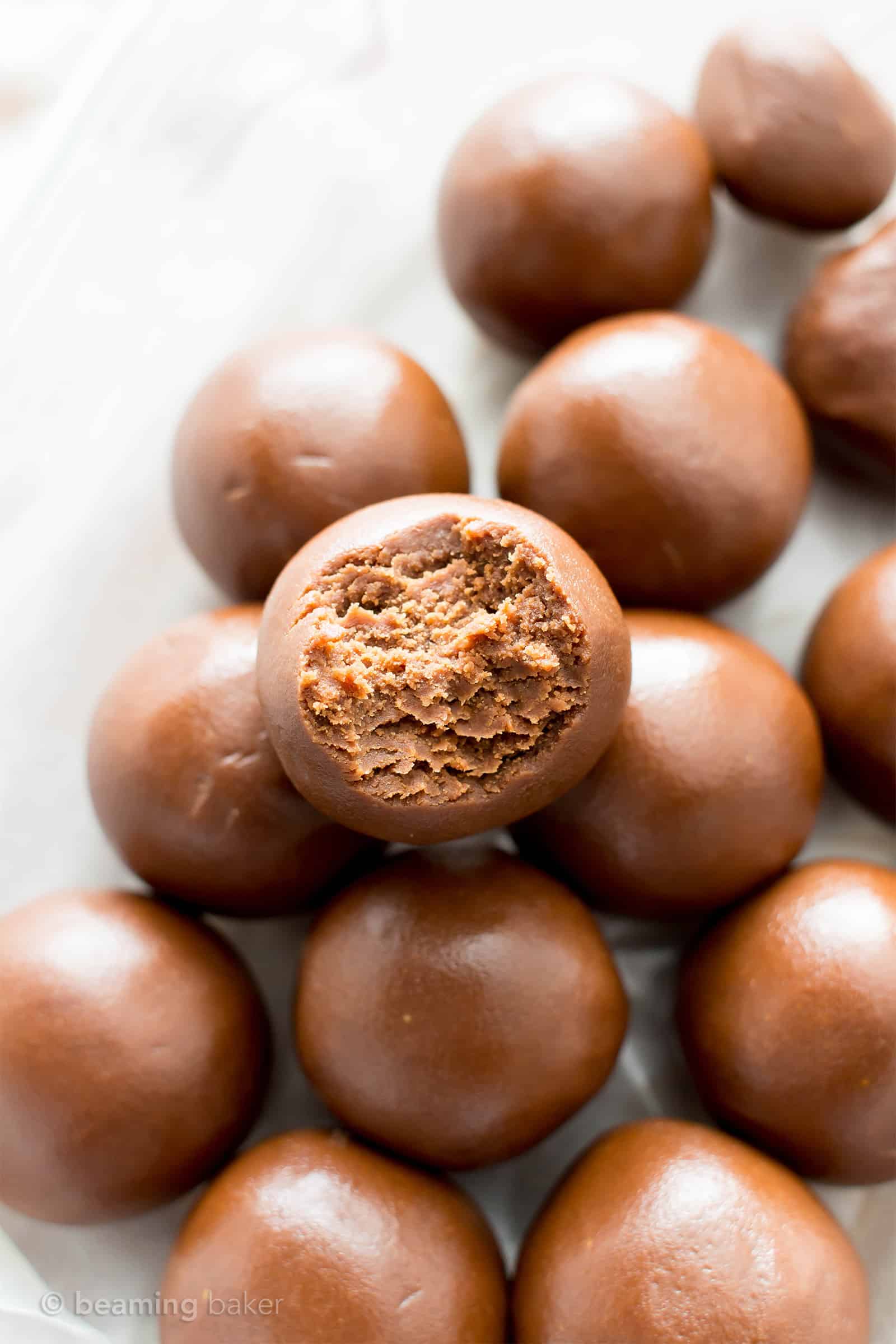 4 Ingredient Chocolate Peanut Butter No Bake Energy Bites Recipe (V, GF): an easy, one bowl recipe for irresistible no bake bites packed with peanut butter and chocolate flavor! #Vegan #GlutenFree #DairyFree #PeanutButter #Chocolate #NoBake #Snacks | Recipe on BeamingBaker.com