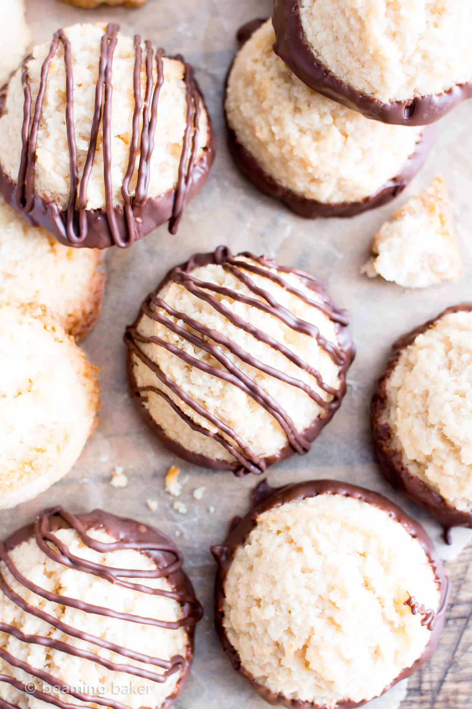 Chocolate Dipped Vegan Coconut Macaroons Recipe (V, GF): an easy recipe for chewy and satisfying chocolate-dipped coconut macaroons made with whole ingredients! #Vegan #Paleo #GlutenFree #DairyFree #Cookies #Dessert | Recipe on BeamingBaker.com