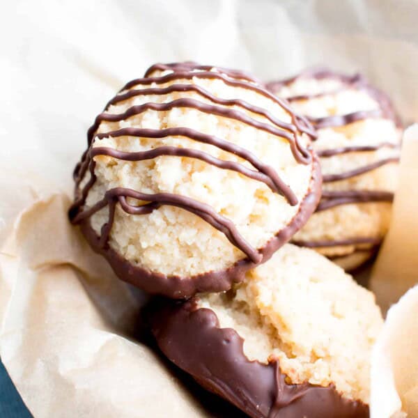 Chocolate Dipped Vegan Coconut Macaroons Recipe (V, GF): an easy recipe for chewy and satisfying chocolate-dipped coconut macaroons made with whole ingredients! #Vegan #Paleo #GlutenFree #DairyFree #Cookies #Dessert | Recipe on BeamingBaker.com