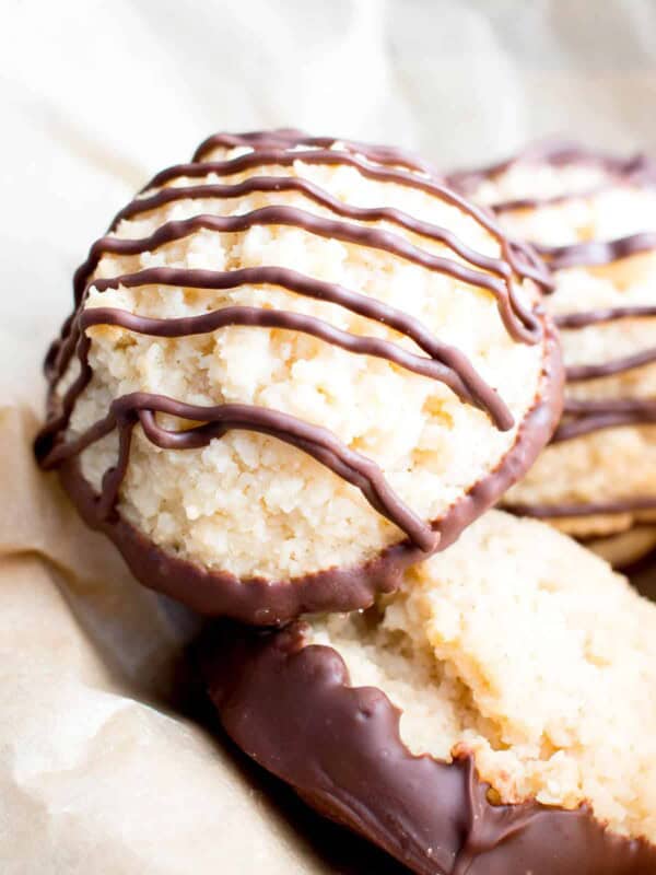 Chocolate Dipped Vegan Coconut Macaroons Recipe (V, GF): an easy recipe for chewy and satisfying chocolate-dipped coconut macaroons made with whole ingredients! #Vegan #Paleo #GlutenFree #DairyFree #Cookies #Dessert | Recipe on BeamingBaker.com